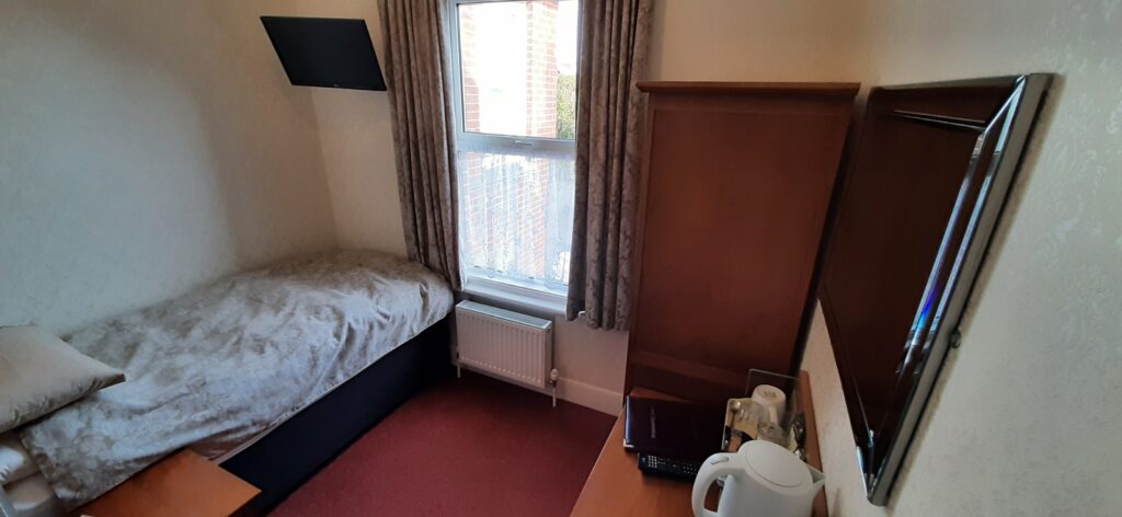 Showing bed, furniture and window in Room 4