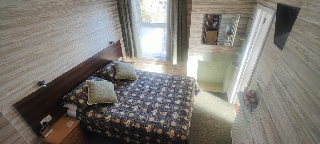 showing bed and window in Room 6